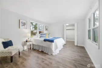 Spacious primary bedroom with walk-in closet and bath