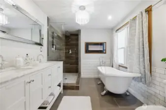 Primary bath with double sinks, clawfoot tub, walk in shower,