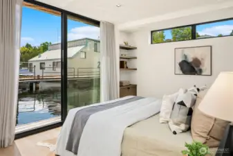 Guest bedroom with outdoor space and covered deck, ensuite bathroom and walk-in closet