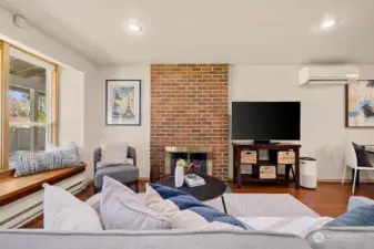Living room features wood burning fireplace