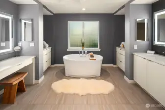 The nicest bathroom in Magnolia!  Soaking tub with privacy glass window, double vanity sink with lighted mirrors, storage, walk-in closet, double shower with frameless enclosure and towel warmer.  Private toilet room.  Designer tile throughout to match the calming color scheme.