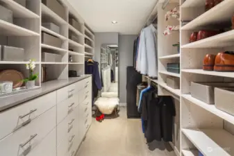 Walk-in closet with California Closets cabinetry and shelving.  3.5" recessed lighting.