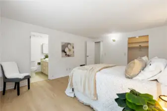 Second view of this updated primary bedroom with 3 piece bathroom and large walk in closet