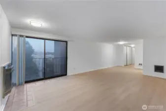 View from large family room looking back to enty kitchen area and looking to east outside with balcony for morning sun and cascade mountain views.  Check out new modern lighting all new interior paint and new hard surface flooring