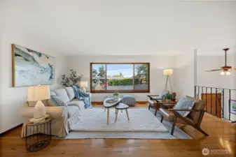 Spacious living room with large windows that flood the room with natural light.