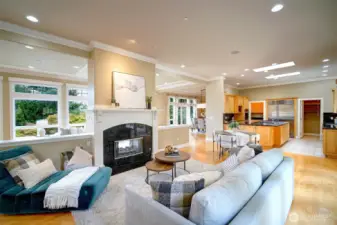 Informal living area off kitchen, cozy gas fireplace and easy access to backyard.