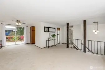 Large living room connects to dining room and sliding glass door to deck.