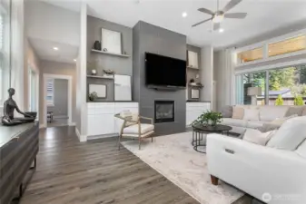 Tiled fireplace from floor to 12 foot ceiling makes this home feel grand!