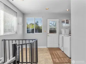 Back of Main unit with stairs to Basement, bathroom, and laundry