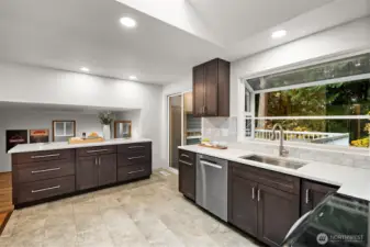 Plenty of counter and storage space with great flow to private deck and family room.