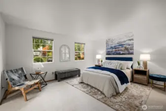 Primary suite roomy and bright and features an ensuite bathroom.