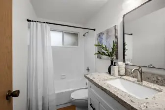 Hall bathroom, with brand new toilet, vanity and refreshed tub!