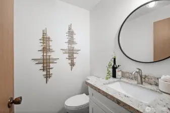 Powder room with brand new toilet and vanity!