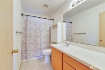 Full bath in the upstairs hall with tub/shower combo.