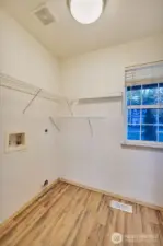 Laundry room with shelving.