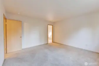 Another view of the primary bedroom with a private bath.