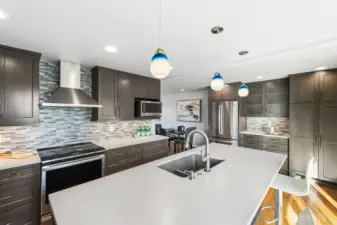 Beautiful tile backsplash, tons of storage and counter space.