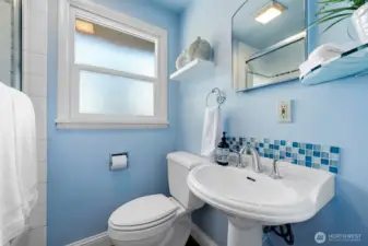 Nicely remodeled full bath off the hallway serves the main level. Tub shower combination, updated fixtures and tile backsplash.