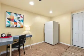 Second refrigerator conveys with the home. The door opens to the back yard.