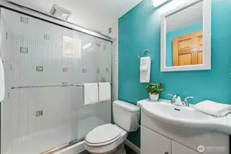 3/4 bath with tile shower stall and updated fixtures serves the lower level.