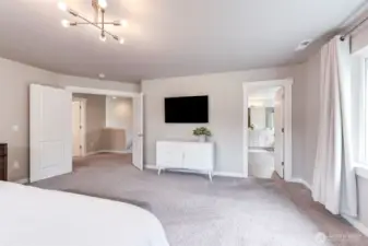 The en suite is on the right. Double doors lead out into the upper hall
