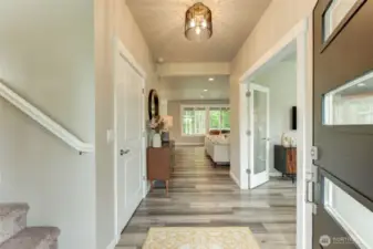 View from the entrance. Straight ahead is the kitchen, dining and great room. To the right is a room which can be used for a den or office.