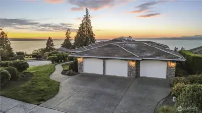 Three-car attached garage on the back side.