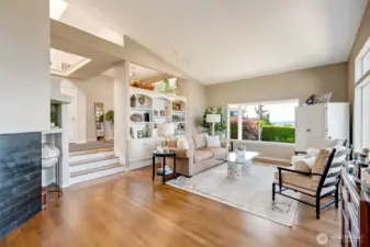 Hardwood floors flow throughout much of the home.  Step down into the living and family rooms.