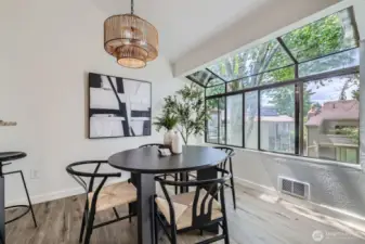 Separate Dining & Bar Soaked In Light From Atrium Windows