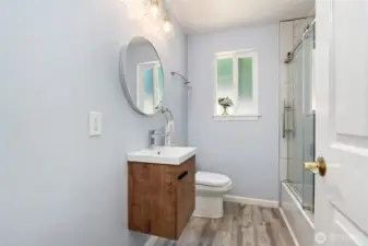 Hallway bathroom with a tub