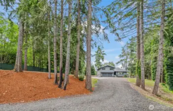 A long meadering private driveway leads to your peaceful oasis!