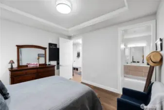 Smart layout meets effortless flow.  The primary suite connects seamlessly to a generous bathroom, making everyday routines feel indulgent. Whether you’re starting your day or winding it down, the thoughtful layout gives you privacy and comfort with zero wasted space.