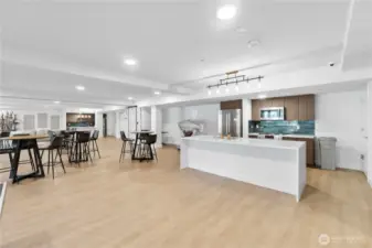 Host without the hassle.  The fully equipped community kitchen offers a sleek and modern setting for larger gatherings, potlucks, or casual evenings with neighbors. Premium appliances, quartz counters, and contemporary finishes give this space an upscale edge, making it feel more like a boutique event venue than a shared amenity