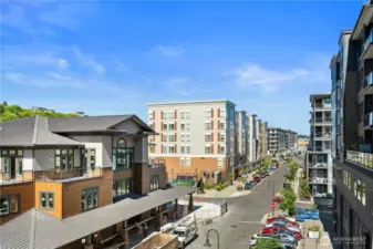 This view from the community patio captures the urban village atmosphere of Point Ruston. Just outside your door are boutique shops, coffee spots, and celebrated restaurants like WildFin American Grill, Stack 571 Burger & Whiskey Bar, and Farrelli’s Pizza. With a fully walkable lifestyle and a lively streetscape, you can enjoy dining, shopping, and entertainment without ever needing to get in your car.