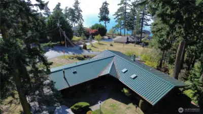 Aerial view of home looking toward water.
