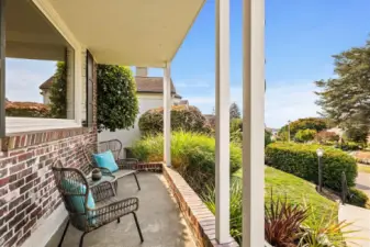 A welcoming front porch sets the tone, perfect for enjoying your morning coffee or evening sunsets. The next phot shows the view when the marine layer lifted.