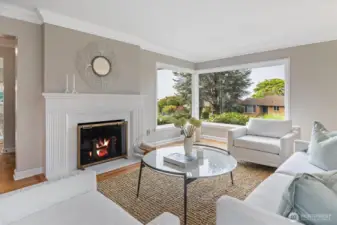 The corner window looks south down the corridor of Edgemont Pl W. to Puget Sound (photo taken with marine layer present)while the large picture window fills the living room with natural light and frames views of the landscaped front garden.