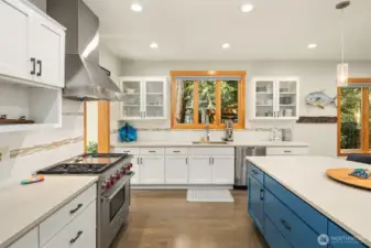 Oversized Quartz seating Island, and subway tile backsplash.