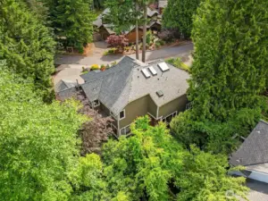 Oversized 2-car garage with shop space. Air conditioning/efficient heat pump, whole-house generator, tankless hot water, and newer roof (2023).