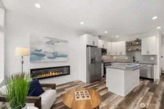 Living area merges with spacious kitchen, great for entertaining.