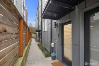 Private entrance to upper residence located in the back.