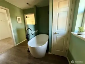 Free standing bath tub in the primary bathroom.