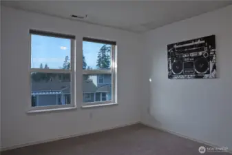 2nd bedroom with big windows.