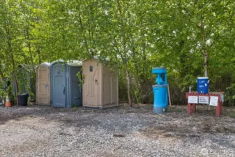 Bathrooms & well/pump house located in this area w/shed.