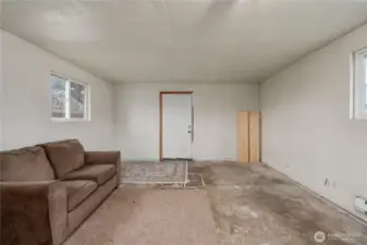 Unfinished living space. Could be converted back into a garage.