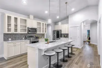 Entry leads to kitchen, den and great room