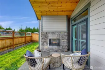 Cozy up next to the outdoor fireplace
