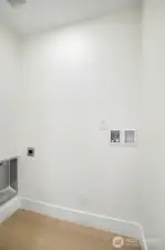 washer and dryer area at lower level