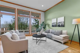 Living room with seating area and expansive windows