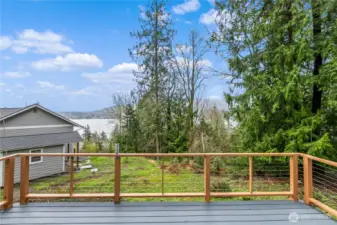 Deck with railing overlooking views of Lake Whatcom
